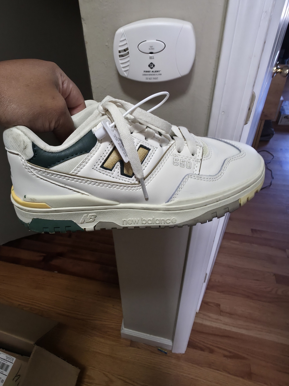 New Balance Kids 550 Sneaker in Cream with Green and Yellow Accents